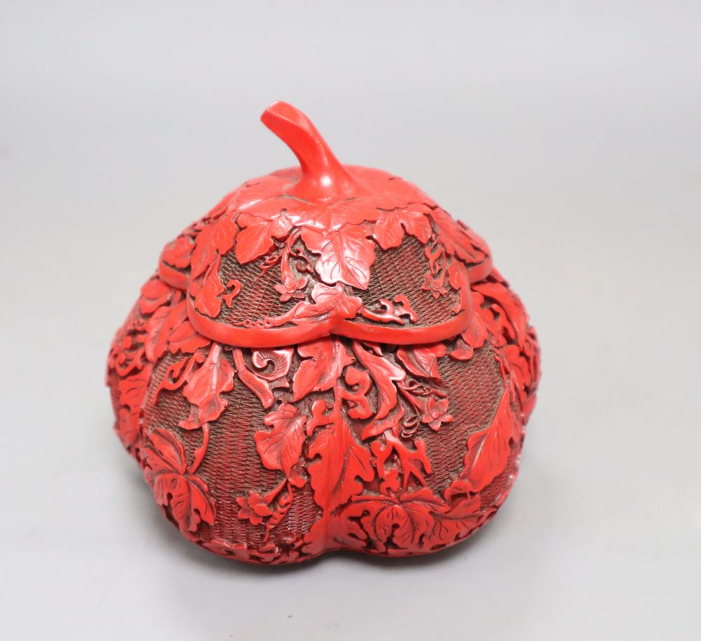 A Chinese cinnabar style box in the form of a fruit, height 12cm